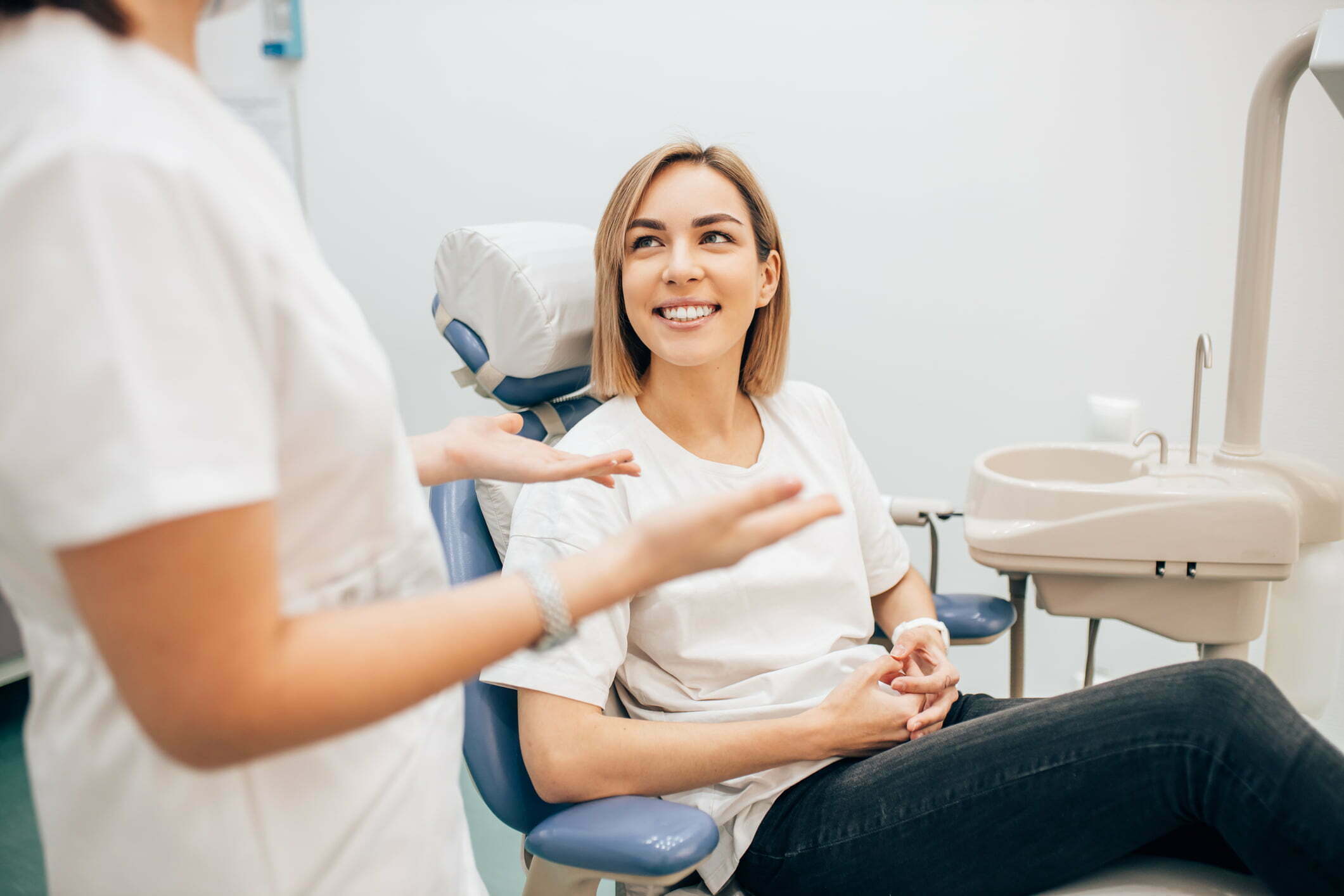 Woman sat in dentist chair smiling