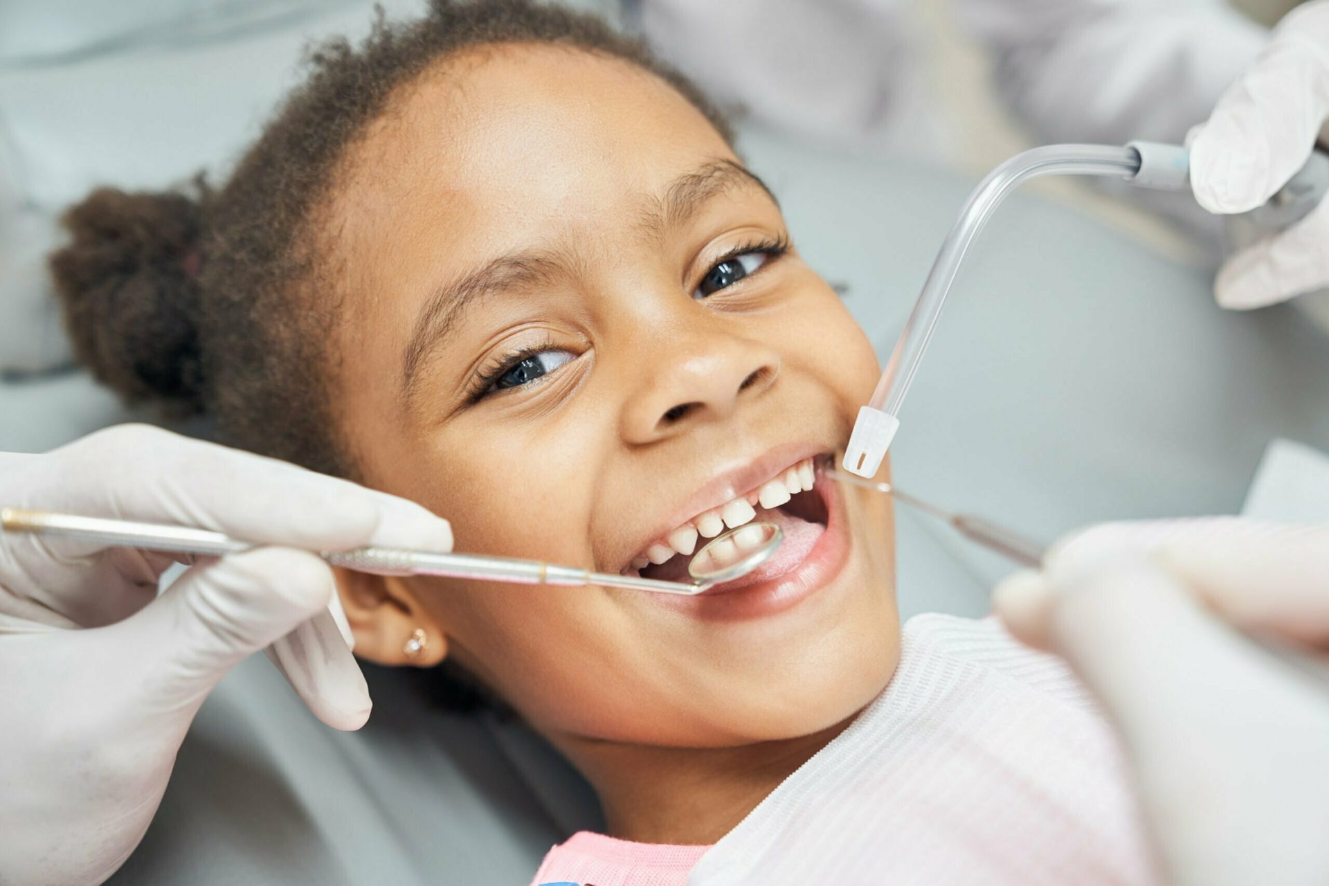 Young girl smiling in the dentist chair