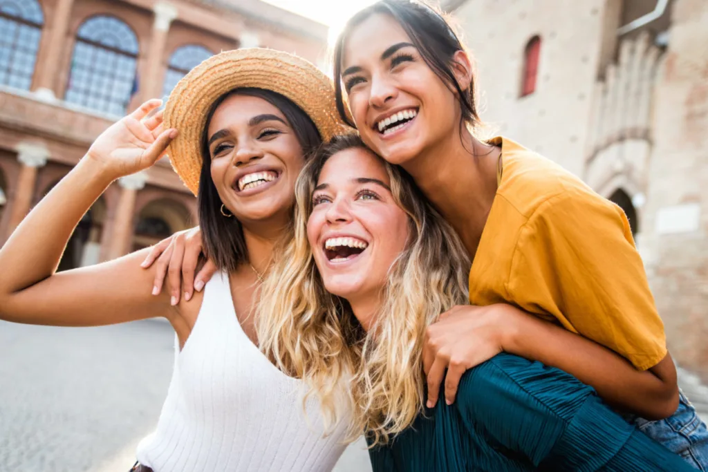 Three women smiling