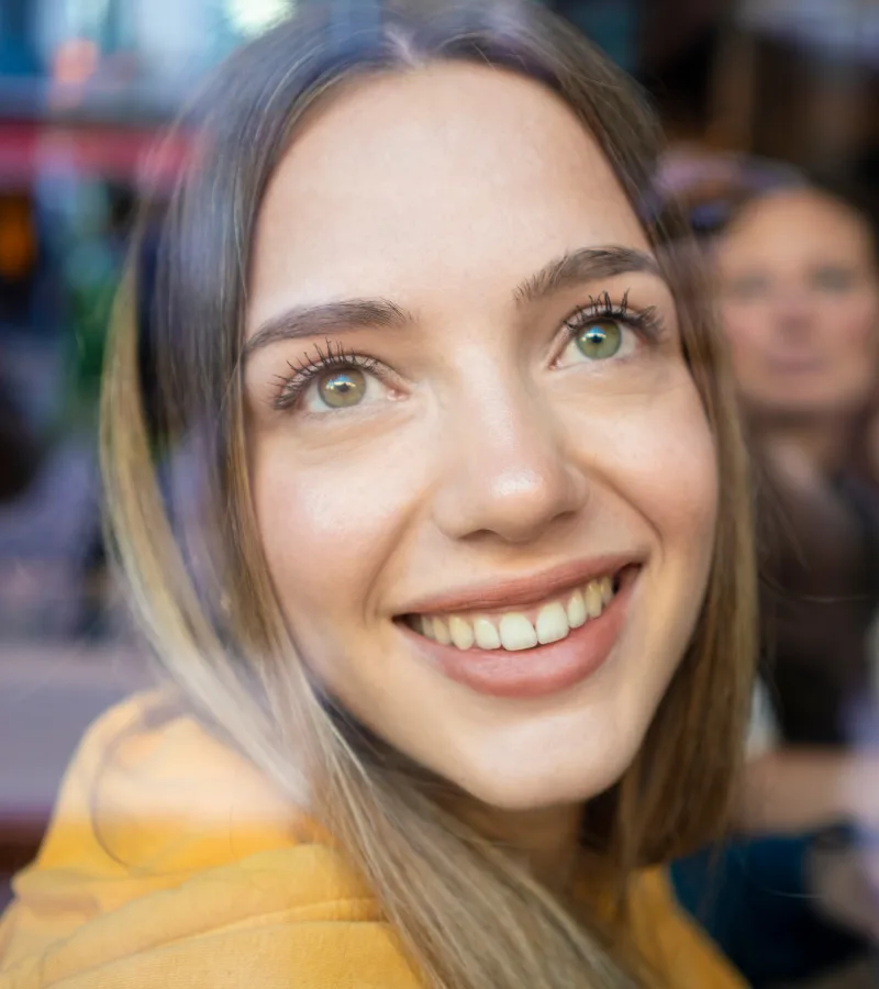 Woman with a healthy smile featured on the gum disease treatment page at Aesthetique Dental Care in Leeds, promoting gum health and awareness.